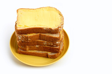 Bread slices with butter on white