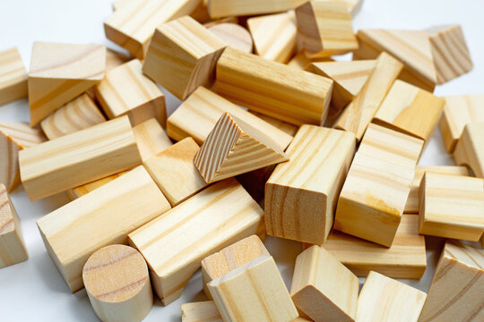 Wooden building blocks on white background.