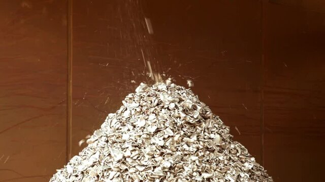 Shredded iron falling on a heap