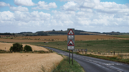 Fototapeta premium Warning sign for Army tanks and helicopters on road accross Sailsbury plain