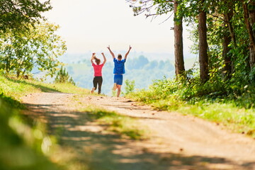 Fototapeta na wymiar couple enjoying in a healthy lifestyle while jogging on a country road