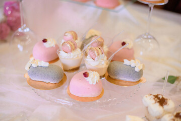 Close up view of bridal bouquet lying on the table. Beautiful bouquet with delicate flowers peonies carnation and greenery decor.