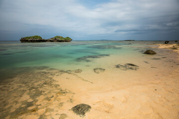 Long exposure of the beautiful turquoise sea of ​​Hoshizuna beach, Iriomote island, Yaeyama, Okinawa, Japan.