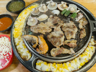 Set of korean grill buffet in restaurant, pork and seafood