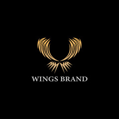 Vector graphics of abstract wing symbol for your company with gold sample text