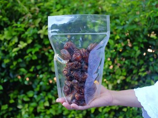 Kurma, in plastic packaging to be ready for sale. The fruit of this palma plant in the phoenix...