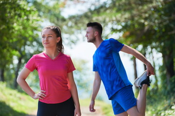 Fototapeta premium couple enjoying in a healthy lifestyle warming up and stretching before jogging