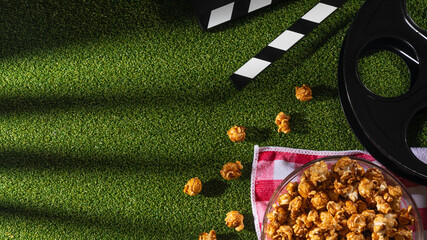 popcorn on the grass, top view.Picnic, watching movies on the street, rest and vacation.Flat lay