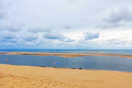 Paragliding at Atlantic Ocean coast . Scenery of Banc d'Arguin island of Atlantic littoral . Beautiful sandy oceanic shore