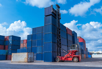 Containers warehouse storage at shipyard loading distribution goods by forklift truck transport delivery export commerce global business.