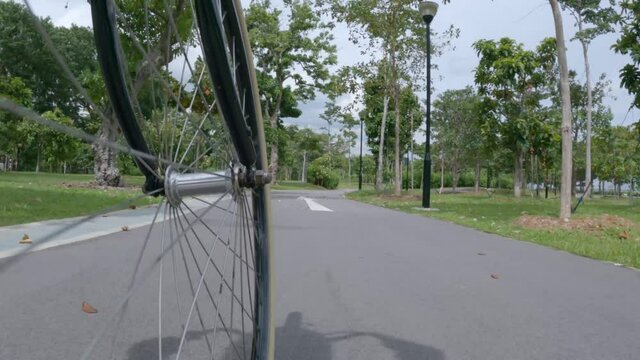 Wheel cam POV on a vintage bicycle, sunny day, on a rural bike path.