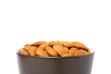 Almond seeds in a coffee mug. No clipping path.