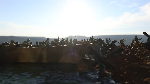 World War 2 reenactment (D-day). Creative decoration with toy soldiers, landing crafts and hedgehogs. Battle scene of Normandy landing on June 6, 1944. Selective focus