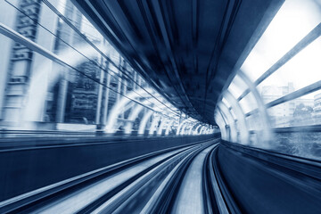 Fototapeta premium Motion blur of train moving inside tunnel