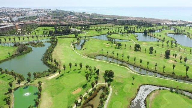 Albufeira, Portugal. Aerial footage of scenic landscape of the resort. Fascinating scenery of the coastal golf course. High quality 4k footage