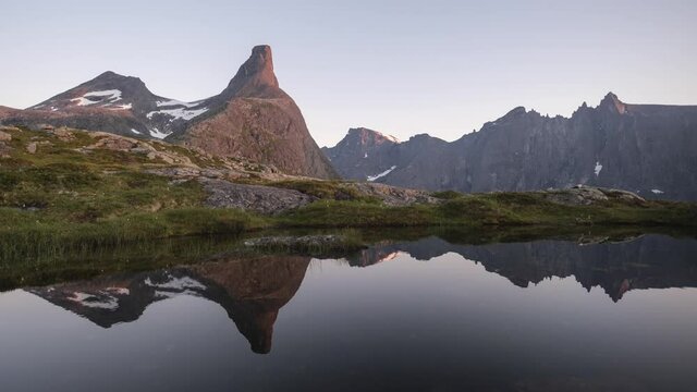 Sunset Timelapse of Norwegian Mountains, View of Romsdalshorn and Trollvegen with Reflection
