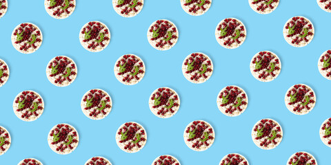 Abstract background from galett. Healthy breakfast with rice cake and pomegranate on black flat lay. Pop art
