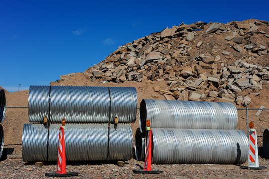 Corrugated culvert pipes at site of construction waste disposal