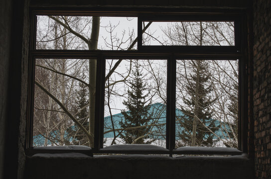 Broken Window In An Abandoned Building. Photo Of Stalkers