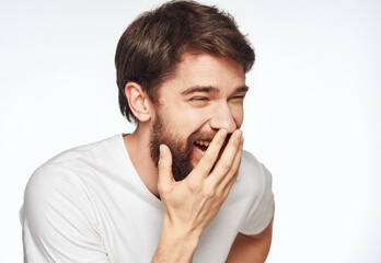 Obraz premium Portrait of a man side view light background white t-shirt model