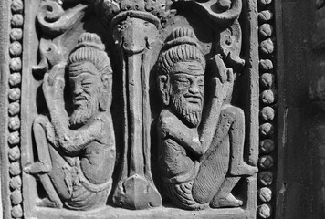 Sand stone craved human is ancient pattern and detail of Khmer art for decorate castle.