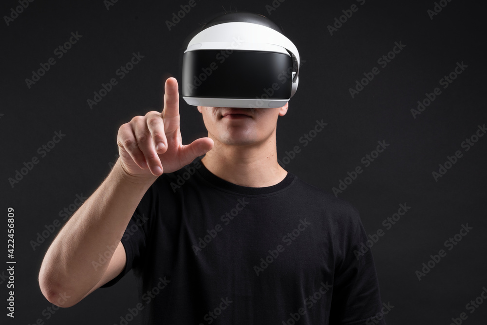 Poster man wearing vr goggles working on virtual invisible screen futuristic technology