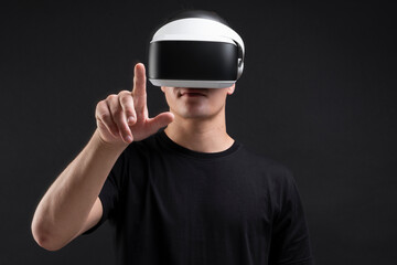 Man wearing VR goggles working on virtual invisible screen futuristic technology