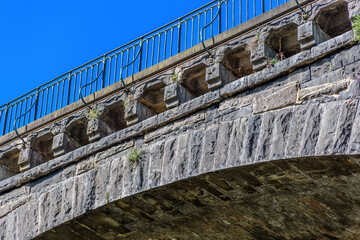 A close view of the stone arch bridge that spans Merri Creek and supports Heidelberg Road in Melbourne, Victoria, Australia
