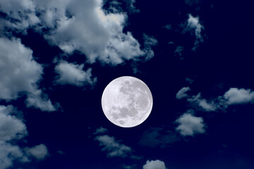 Full moon with clouds on the sky.