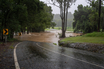 If it is flooded forget it. Fast flowing water submerges a country road.