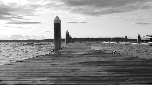 floating wooden dock at stor coastal weather