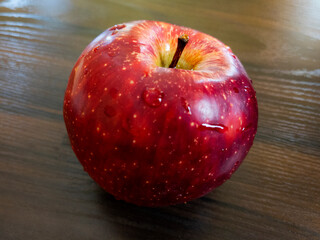 fresh red apple isolated on wooden background
