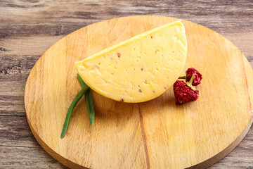 Hard cheese brick with walnut