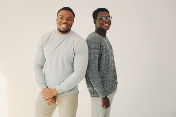 Handsome black men standing on a white background