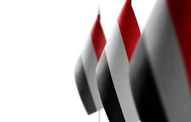 Small national flags of the Yemen on a white background
