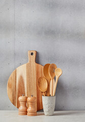 Cutting board, spoons, salt and pepper © goir