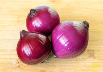Red onions on a cutting board