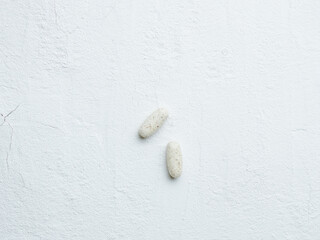 Pills on white background. Vitamin and mineral tablet.