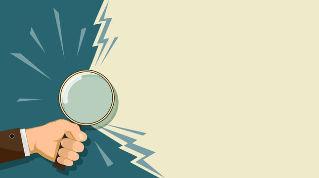Man holding a magnifying glass in his hand