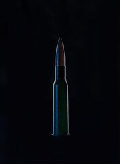 7.62 caliber military cartridge on black isolated background