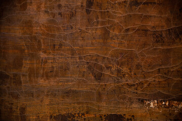 brown, yellow and black colors on a textured, cracked painted surface,  background