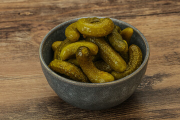 Pickled gherkin in the bowl