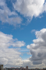 Obraz premium White clouds in blue sky over the city