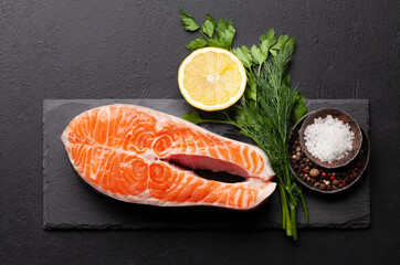 Fresh raw salmon cooking. Fish steak with herbs and spices