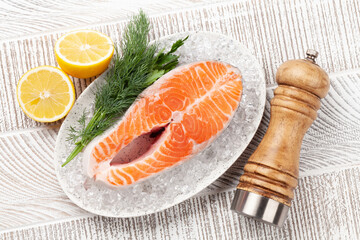 Fresh raw salmon cooking. Fish steak with herbs and spices