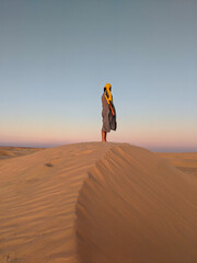 Young man posing in the desert of Tunisia