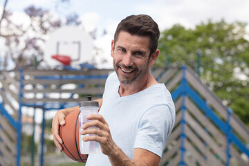 fit male playing basketball outdoor