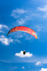 Paragliding extreme Sport with blue Sky and clouds on background Healthy Lifestyle and Freedom...