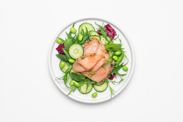 Salmon salad with cucumber, spinach, mizuna salad, radicchio. Healthy food, diet. Salted salmon in modern plate on white background 