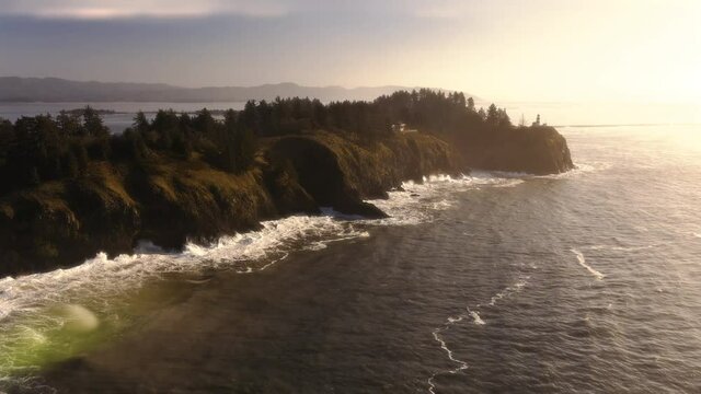 Cape Disappointment Aerial View with Golden Sun Lens Flare on Lighthouse Cliff